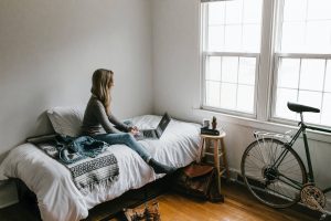 A woman working remotely in her bedroom - Darren Yaw's latest news