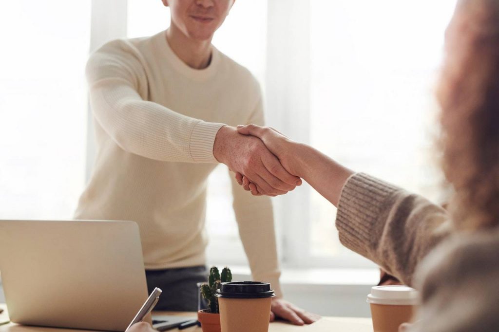 A man and a woman shaking hands - Darren Yaw Singapore